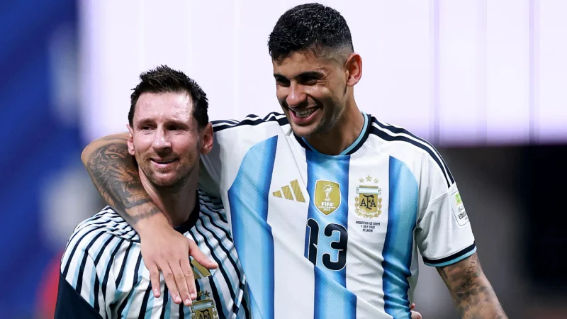 messi-with-cristian-romero-1788606476